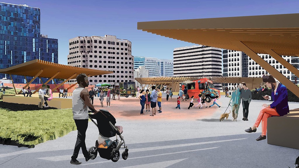 A group of people walking around a large building.